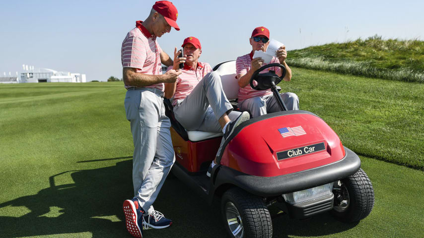 JERSEY CITY, NJ - SEPTEMBER 25: (L-R) Jim Furyk, Captains Assistant of the U.S. Team,  Captain Steve Stricker and Captain's Assistant Davis Love III talk prior to the start of the Presidents Cup at Liberty National Golf Club on September 25, 2017, in Jersey City, New Jersey. (Photo by Chris Condon/PGA TOUR)