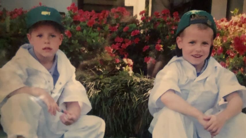 The Coody twins served as co-caddies for their grandpa Charles at the 2006 Par 3 Contest. (Courtesy of Coody family)