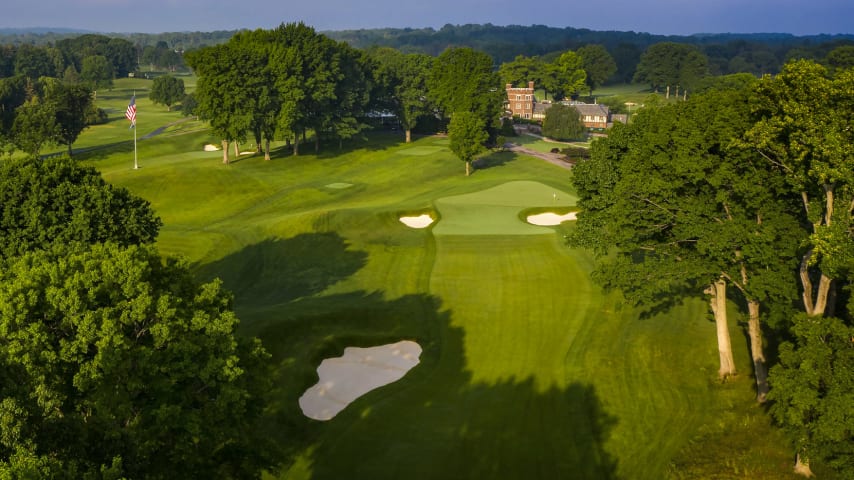 The par 4 ninth is a tough uphill dogleg right with a fairway that narrows the farther up a tee shot goes. Any drive on the right side runs the risk of out of bounds or being blocked out by overhanging trees. The approach shot is likely a mid-iron to a green that slopes from back to front. Missing long or left could provide a challenging up and down for par. (Source: PGA of America)