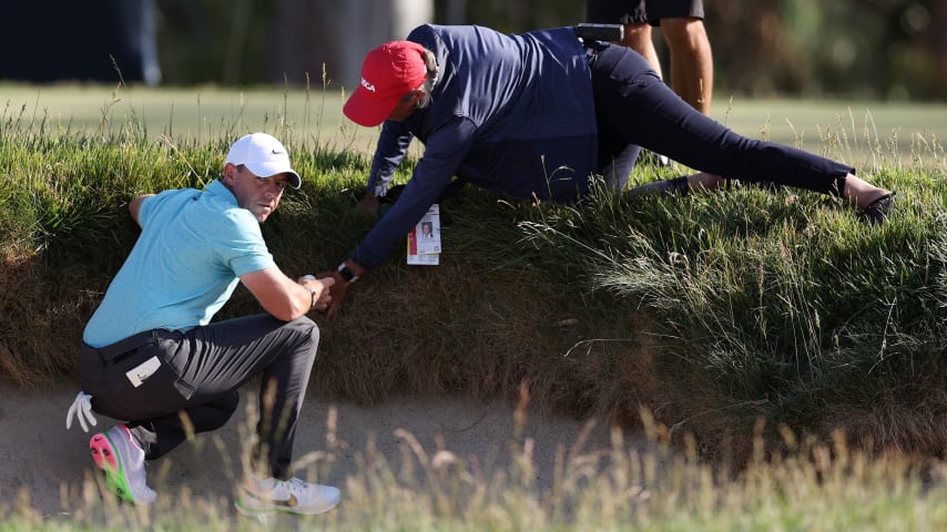LOS ANGELES, CALIFORNIA - JUNE 18: Rory McIlroy of Northern Ireland gets relief from an imbedded ball on the 14th green during the final round of the 123rd U.S. Open Championship at The Los Angeles Country Club on June 18, 2023 in Los Angeles, California. (Photo by Richard Heathcote/Getty Images)