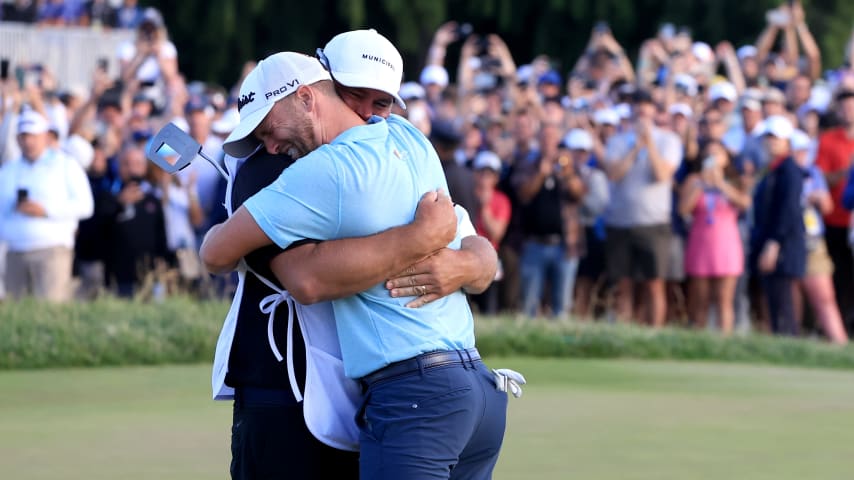 LOS ANGELES, CALIFORNIA - JUNE 18: Wyndham Clark of the United States reacts with his caddie John Ellis after his winning putt on the 18th green during the final round of the 123rd U.S. Open Championship at The Los Angeles Country Club on June 18, 2023 in Los Angeles, California. (Photo by Sean M. Haffey/Getty Images)