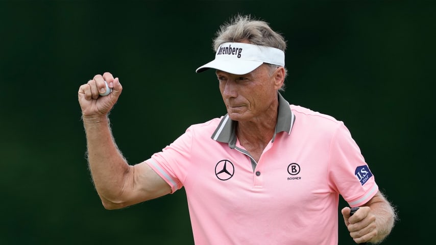 Fellow pros paint portrait of Bernhard Langer beyond the ropes