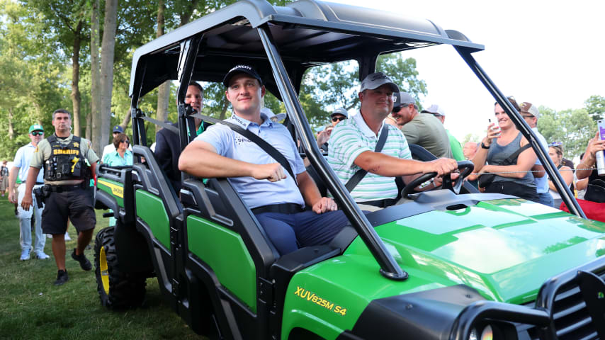 SILVIS, ILLINOIS - JULY 09: Sepp Straka of Austria is driven to the 18th hole for the trophy ceremony after winning the John Deere Classic at TPC Deere Run on July 09, 2023 in Silvis, Illinois. (Photo by Michael Reaves/Getty Images)