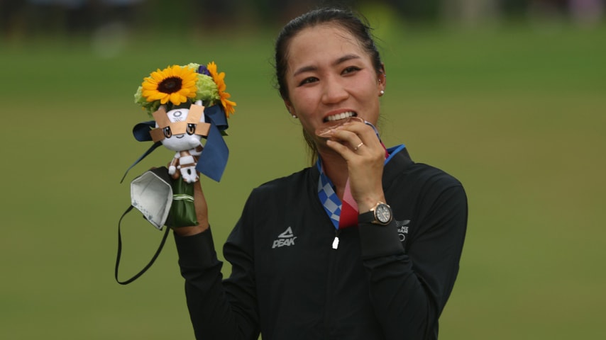 Lydia Ko of Team New Zealand celebrates with the silver medal at the victory ceremony after the final round of the Women's Individual Stroke Play on day fifteen of the Tokyo 2020 Olympic Games at Kasumigaseki Country Club on August 07, 2021 in Kawagoe, Japan. (Photo by Mike Ehrmann/Getty Images)