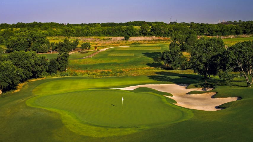 The first of the par 3 holes at TPC Craig Ranch. This hole should require a mid to long iron. Avoid the big bunker short left of the green.