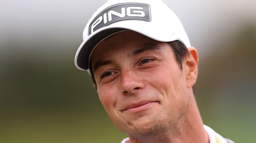 VIRGINIA WATER, ENGLAND - SEPTEMBER 12: Viktor Hovland of Norway smiles on the range prior to the BMW PGA Championship at Wentworth Golf Club on September 12, 2023 in Virginia Water, England. (Photo by Richard Heathcote/Getty Images)