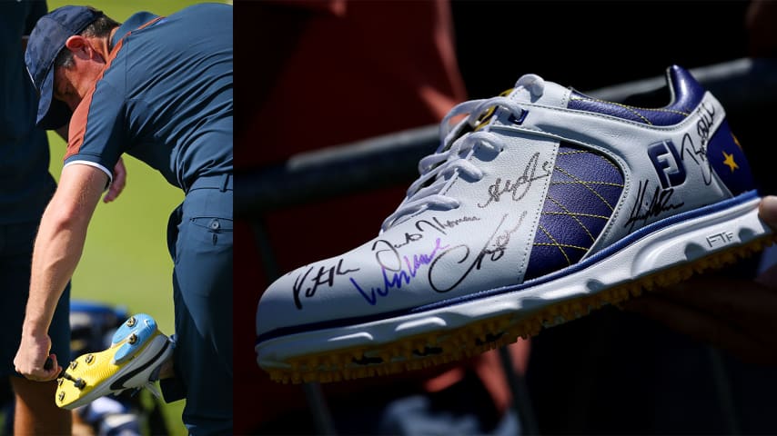 On the left, Rory McIlroy screws spikes into his shoes. On the right, a fan holds up an autographed Ryder Cup FootJoy golf shoe. (Getty Images)