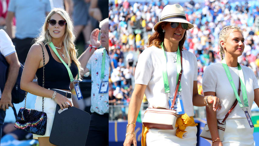 On the left, Kelley Cahill, wife of Jon Rahm looks on during the Friday Foursomes session at the 44th Ryder Cup. On the right, Anna Molinari, wife of European vice captain Edoardo Molinari, and Katherine Gaal, fiance to Matt Fitzpatrick walk during the Sunday Singles session. (Getty Images)