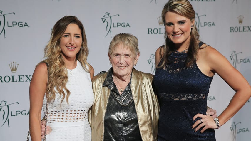 Shirley Spork (center) poses with LPGA players Jaye Marie Green (left) and Lexi Thompson at the 2015 LPGA Rolex Players Award. (Getty Images)