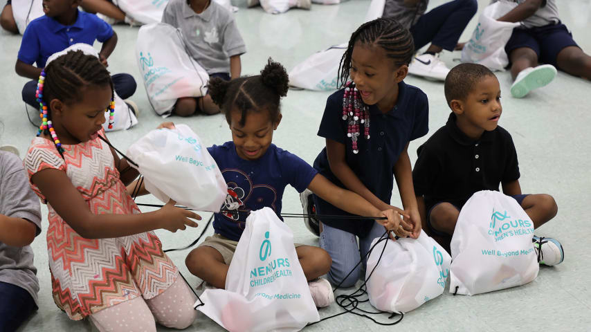 Children participating in Blessings in a Backpack (Photo Credit: William Estep/Nemours Children's Health System)
