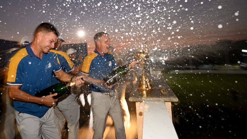 Nicolai Højgaard sprays champagne alongside European Captain Luke Donald during the celebrations after the Sunday Singles matches of the 2023 Ryder Cup at Marco Simone Golf Club. (Ross Kinnaird/Getty Images)