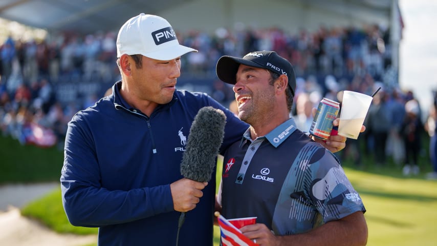 NEWBURGH, INDIANA - OCTOBER 08: Chan Kim of the United States interviews Rafael Campos of Puerto Rico during the trophy ceremony after the final round of the Korn Ferry Tour Championship presented by United Leasing and Finance at Victoria National Golf Club on October 8, 2023 in Newburgh, Indiana. (Photo by Andrew Wevers/PGA TOUR)