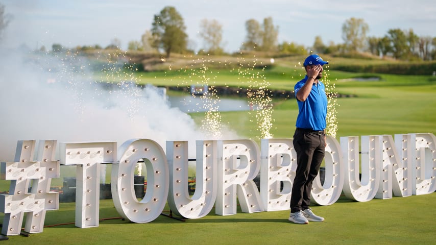 NEWBURGH, INDIANA - OCTOBER 08: Tom Whitney of the United States salutes during the TOUR Card ceremony after the final round of the Korn Ferry Tour Championship presented by United Leasing and Finance at Victoria National Golf Club on October 8, 2023 in Newburgh, Indiana. (Photo by Andrew Wevers/PGA TOUR)