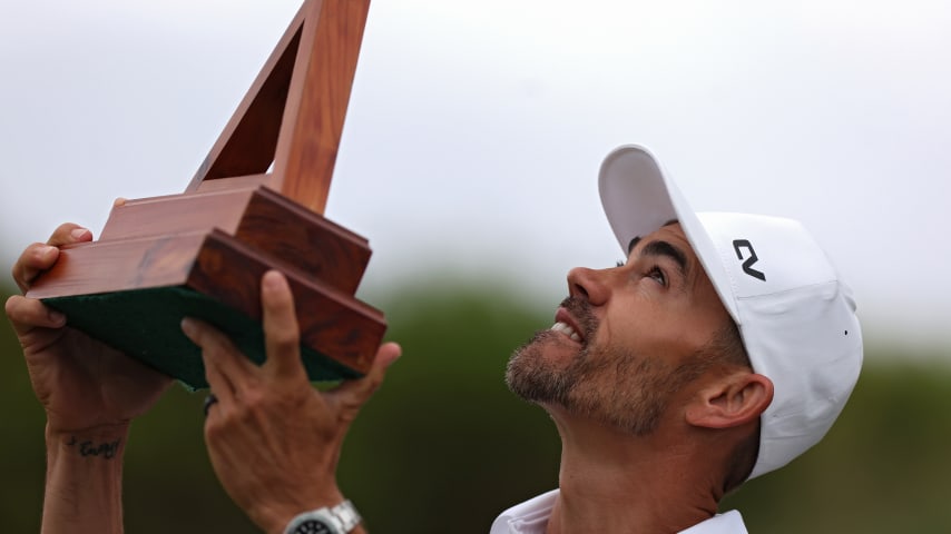 SOUTHAMPTON, BERMUDA - NOVEMBER 12: Camilo Villegas of Colombia celebrates looks skyward with the trophy after winning the Butterfield Bermuda Championship at Port Royal Golf Course on November 12, 2023 in Southampton, Bermuda. (Photo by Marianna Massey/Getty Images)