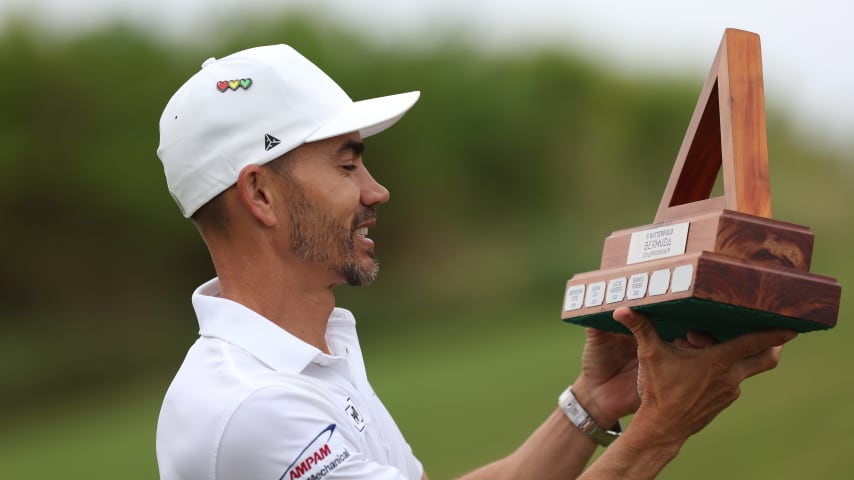 SOUTHAMPTON, BERMUDA - NOVEMBER 12: Camilo Villegas of Colombia celebrates looks a the trophy after winning the Butterfield Bermuda Championship at Port Royal Golf Course on November 12, 2023 in Southampton, Bermuda. (Photo by Marianna Massey/Getty Images)