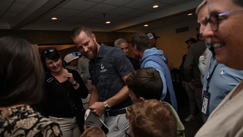 Chris Kirk embraces family after receiving the PGA TOUR Courage Award at The RSM Classic. (Tracy Wilcox/PGA TOUR)