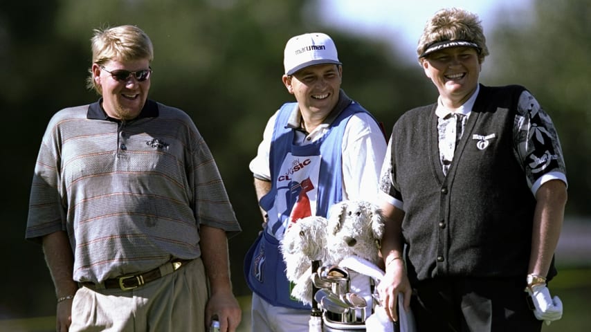 Laura Davies (right) and John Daly (left) in action during the 1998 JCPenney Classic in Innisbrook Resort in Palm Harbor, Florida. (Vincent Laforet/Allsport)