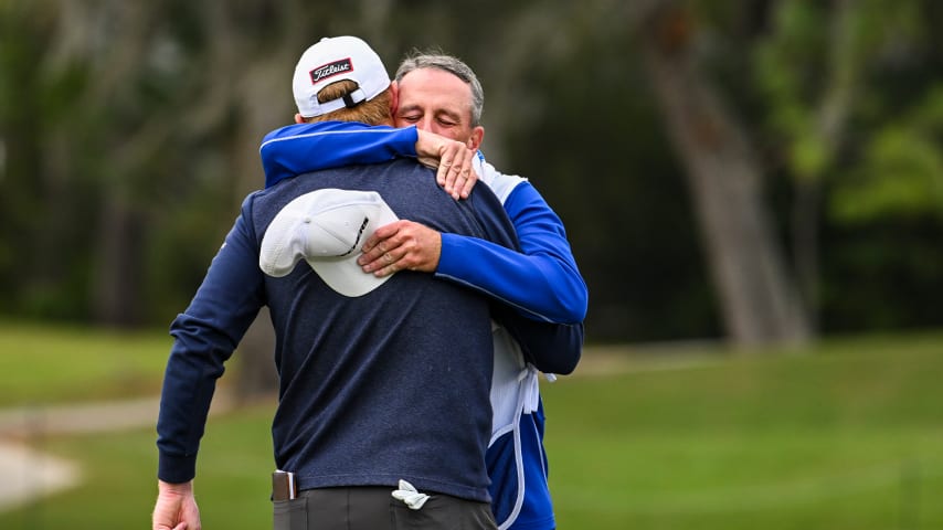 Hayden Springer hugs his caddie after making birdie on the 18th hole in the first round of Q-School's Final Stage. (Keyur Khamar/PGA TOUR)