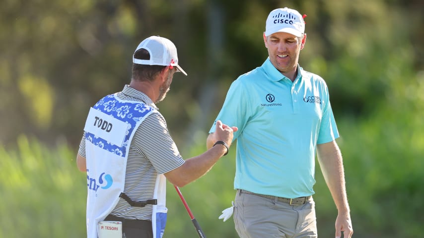 Brendon Todd fist bumps caddie Paul Tesori on the fourth green during the second round of The Sentry. (Michael Reaves/Getty Images)