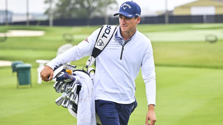 CHAMPAIGN, ILLINOIS - SEPTEMBER 28: Adrien Dumont de Chassart carries his bag after practice at the University of Illinois on September 28, 2023 in Champaign, Illinois. (Photo by Ben Jared/PGA TOUR)