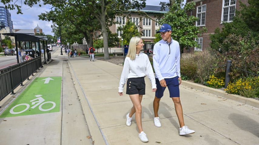 CHAMPAIGN, ILLINOIS - SEPTEMBER 28:  Adrien Dumont de Chassart smiles while walking his girlfriend Katie Underwood on the campus of the University of Illinois on September 28, 2023 in Champaign, Illinois. (Photo by Ben Jared/PGA TOUR)