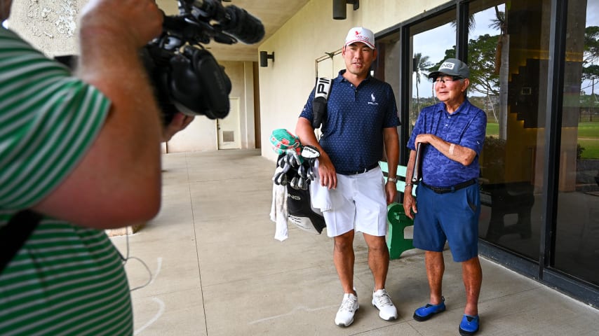 Chan Kim with his coach Les Uyehara at his course as a young player, Ala Wai Golf Course, prior to Sony Open in Honolulu, Hawaii. (Tracy Wilcox/PGA TOUR)