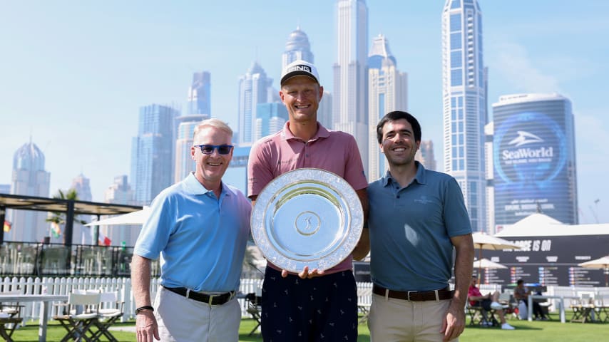 Adrian Meronk was presented with the Seve Ballesteros Award for the 2023 DP World Tour Player of the Year by Javier Ballesteros (R) and DP World Tour Chief Executive Keith Pelley (L) prior to the Hero Dubai Desert Classic. (Richard Heathcote/Getty Images)