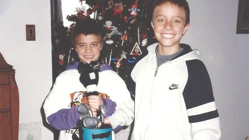 Tom Whitney (L) and Bob Whitney (R) after receiving their first set of golf clubs for Christmas. (Photo courtesy of Whitney family)