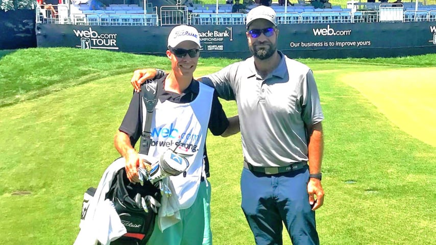 Bob Whitney (L) caddying for Tom Whitney (R) at the Pinnacle Bank Championship. (Photo courtesy of Whitney family)