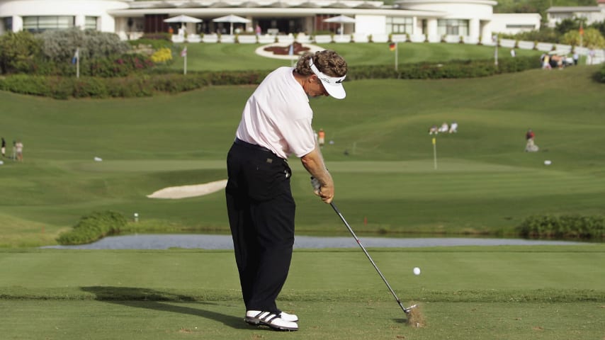 Bernhard Langer tees off on the par-3 18th during the second round of the World Cup of Golf at the Sandy Lane Resort in St. James, Barbados in 2006. (Ross Kinnaird/Getty Images)