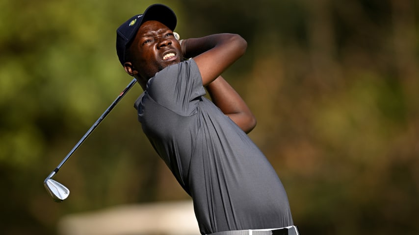 Ronald Rugumayo holed a birdie putt on the final hole to make the cut at the Magical Kenya Open. (Stuart Franklin/Getty Images)