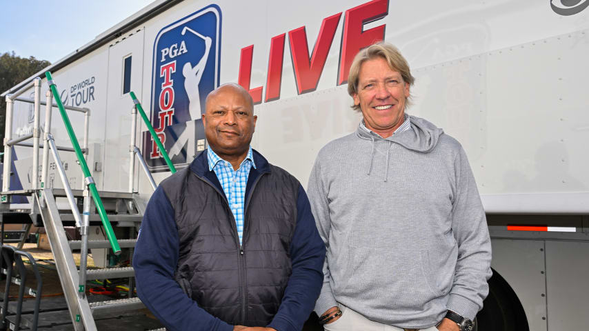 Mark Dusbabek and Orlando Pope pose for a photo outside the PGA TOUR LIVE truck. (Ben Jared/PGA TOUR)