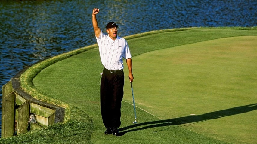 Tiger Woods celebrates after his "better than most" putt during the third round of THE PLAYERS Championship in 2001. (Stan Badz/PGA TOUR) 