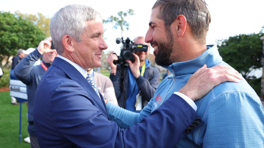 PONTE VEDRA BEACH, FLORIDA - MARCH 13: PGA Tour Commissioner Jay Monahan hands Matthieu Pavon of France a set of Tiffany & Co. cuff links presented as a gift during the First Timers Press Conference prior to THE PLAYERS Championship  on the Stadium Course at TPC Sawgrass on March 13, 2024 in Ponte Vedra Beach, Florida. (Photo by Kevin C. Cox/Getty Images)