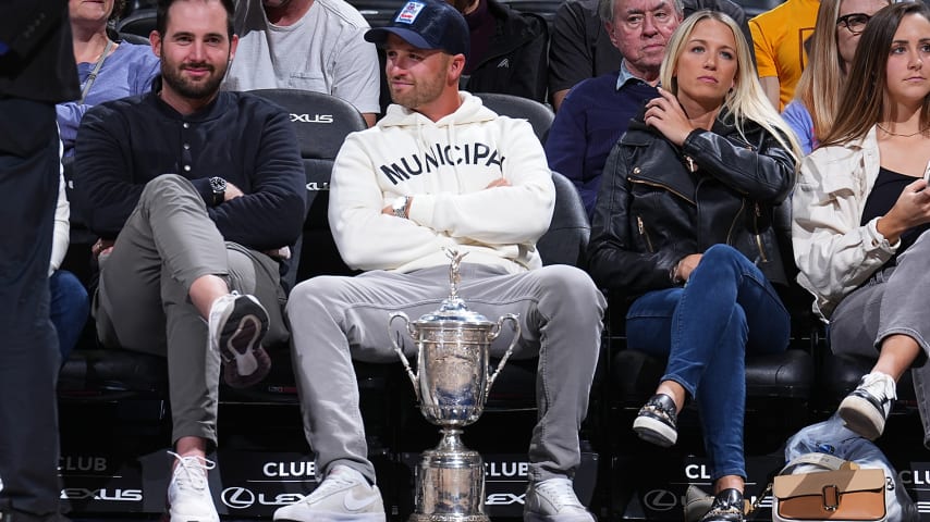 Wyndham Clark sits courtside with the U.S. Open trophy for the  Denver Nuggets' win over the New York Knicks on Thursday, March 21. (Photo courtesy Denver Nuggets)