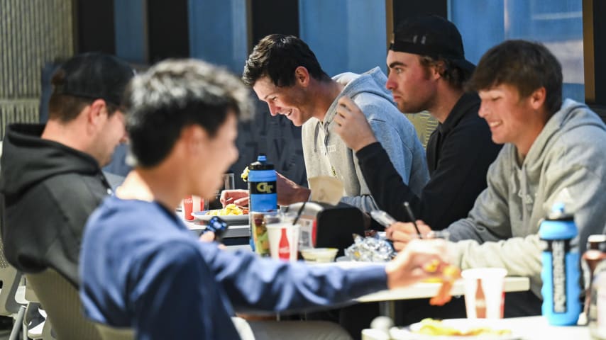 ATLANTA, GEORGIA - NOVEMBER 02:  Christo Lamprecht of South Africa eats breakfast with his golf teammates in the Hugh Spruill Strength Center during a PGA TOUR University shoot at the Georgia Institute of Technology on November 2, 2023 in Atlanta, Georgia. (Photo by Keyur Khamar/PGA TOUR)