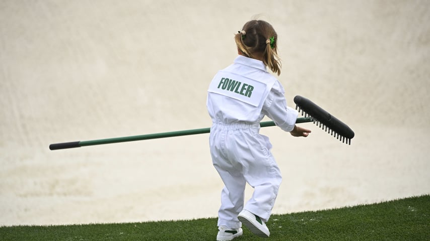 Maya Fowler readies to rake a bunker at the Masters Par 3 Contest. (Ben Jared/PGA TOUR)