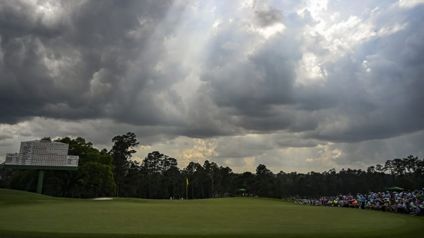 A scenic view of the 18th hole green as sunbeams break through the clouds during the first round of the 2023 Masters Tournament. (Keyur Khamar/PGA TOUR via Getty Images)