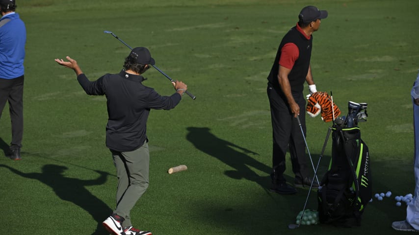 Tiger Woods warms up in the practice area with his son Charlie Woods during the final round of the 2024 Masters Tournament. (Ben Jared/PGA TOUR)