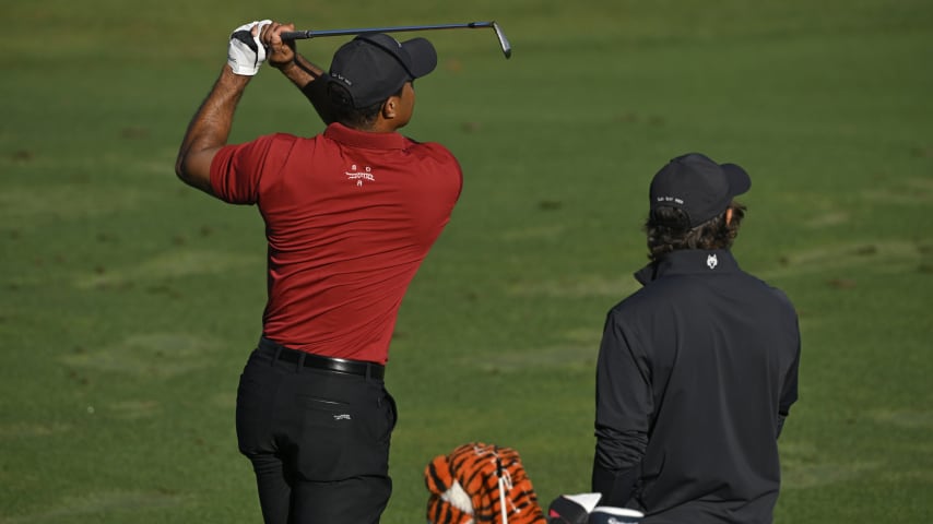 Tiger Woods and his son Charlie on the range during the final round of the 2024 Masters Tournament. (Ben Jared/PGA TOUR)