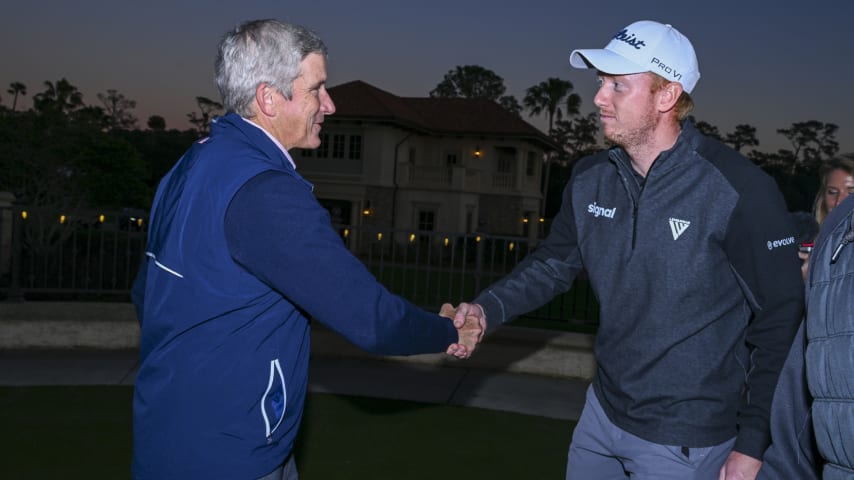 Hayden Springer is congratulated by PGA TOUR Commissioner Jay Monahan after earning his PGA TOUR card. (Tracy Wilcox/PGA TOUR)