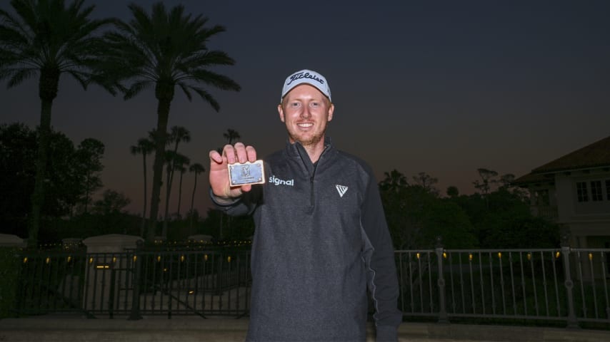 Hayden Springer poses with his PGA TOUR card after the final round of the PGA TOUR Q-School presented by Korn Ferry. (Tracy Wilcox/PGA TOUR via Getty Images)