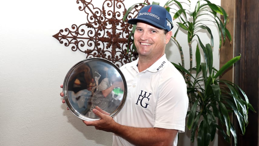 MCKINNEY, TEXAS - MAY 01: Zach Johnson  of the United States holds up a tray commemorating his 500th career start prior to THE CJ CUP Byron Nelson at TPC Craig Ranch on May 01, 2024 in McKinney, Texas. (Photo by Tim Heitman/Getty Images)