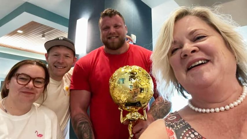 Becky Large (right) with Tom Stoltman, who is on the autism spectrum and won the World’s Strongest Man title in Myrtle Beach. (Courtesy Champions Autism Network)