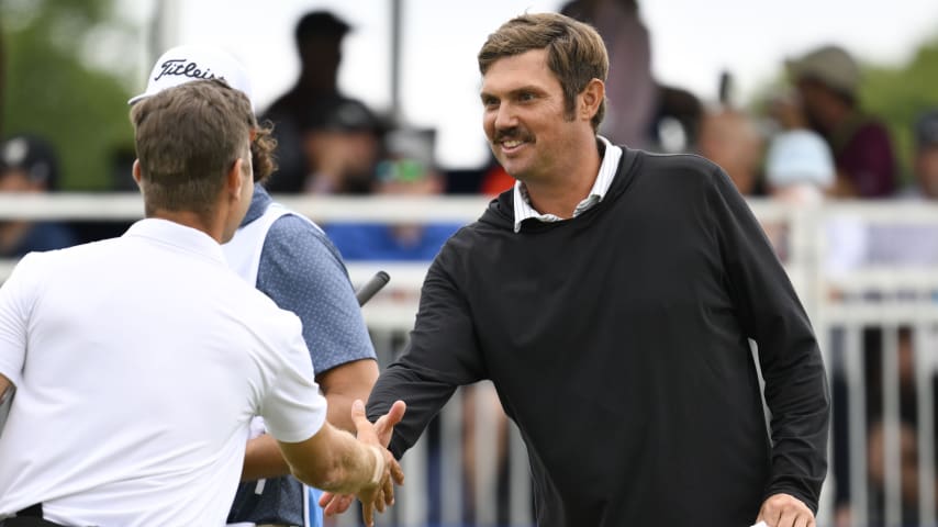 Jeff Overton is congratulated after making birdie on the 18th hole to put him at 8-under during the first round of the AdventHealth Championship at Blue Hills Country Club on May 16, 2024, in Kansas City, Missouri. (Reed Hoffmann/Getty Images)