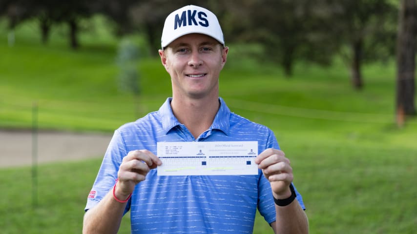 New Zealand's Harry Hillier shows off his scorecard after posting the first sub-60 score in PGA TOUR Americas history Friday at the first sub-60 score in PGA TOUR Americas history at the Inter Rapidisimo Golf Championship. (Paulina Gongora/PGA TOUR)