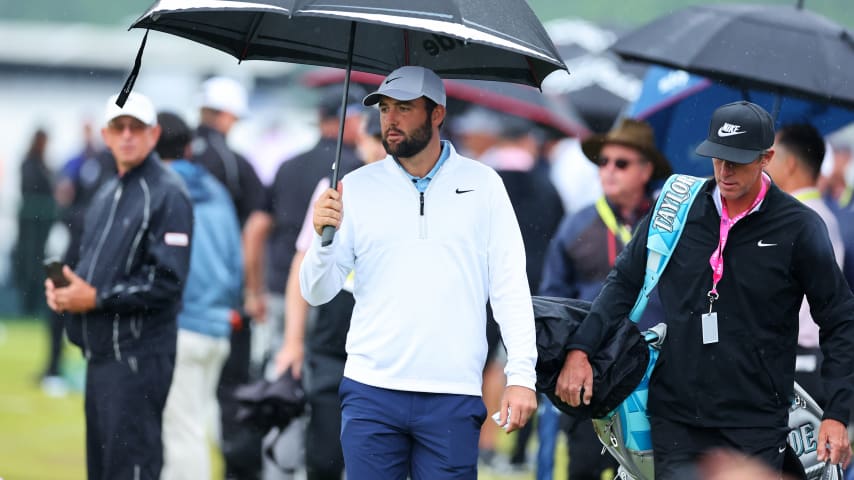 Scottie Scheffler of the United States and his caddie, Ted Scott, walk on the driving range during the second round of the 2024 PGA Championship at Valhalla Golf Club on May 17, 2024 in Louisville, Kentucky. (Michael Reaves/Getty Images)