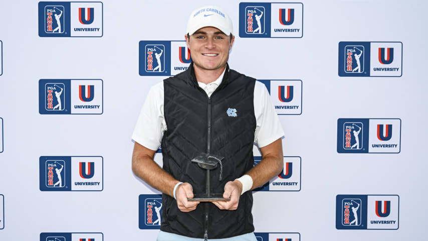 Austin Greaser of the University of North Carolina smiles with a trophy after finishing third in the PGA TOUR University rankings, securing him fully exempt Korn Ferry Tour membership for the remainder of the 2024 season during the NCAA D1 Men’s Golf Championship on the North Course at the Omni La Costa Resort & Spa on May 27, 2024 in Carlsbad, California. (Keyur Khamar/PGA TOUR)