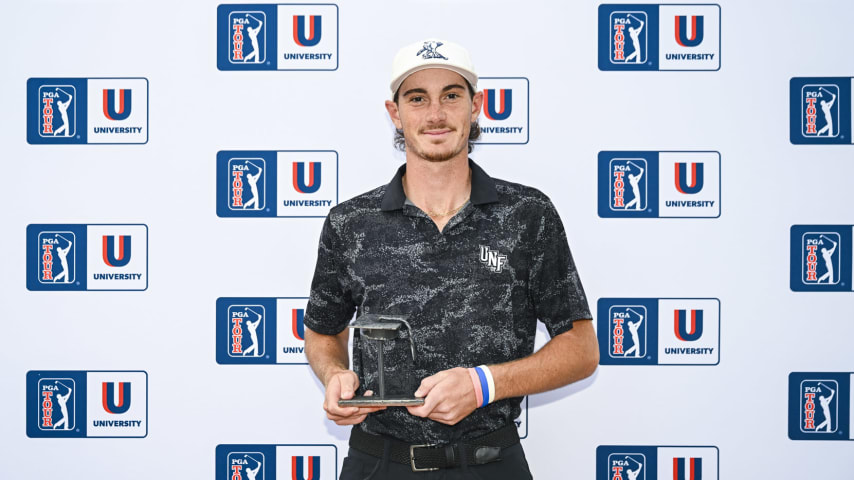 Nicholas Gabrelcik of University of North Florida smiles with a trophy after finishing fifth in the PGA TOUR University rankings, securing him fully exempt Korn Ferry Tour membership for the remainder of the 2024 season during the NCAA D1 Men’s Golf Championship on the North Course at the Omni La Costa Resort & Spa on May 27, 2024 in Carlsbad, California. (Photo by Keyur Khamar/PGA TOUR)