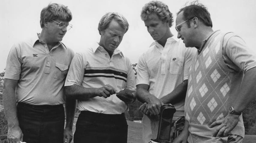 Jack Nicklaus (second from the left), with his son Jack (third from the left) as caddie, talks to fellow golfers in 1984. (Credt Columbus Citizen-Journal)